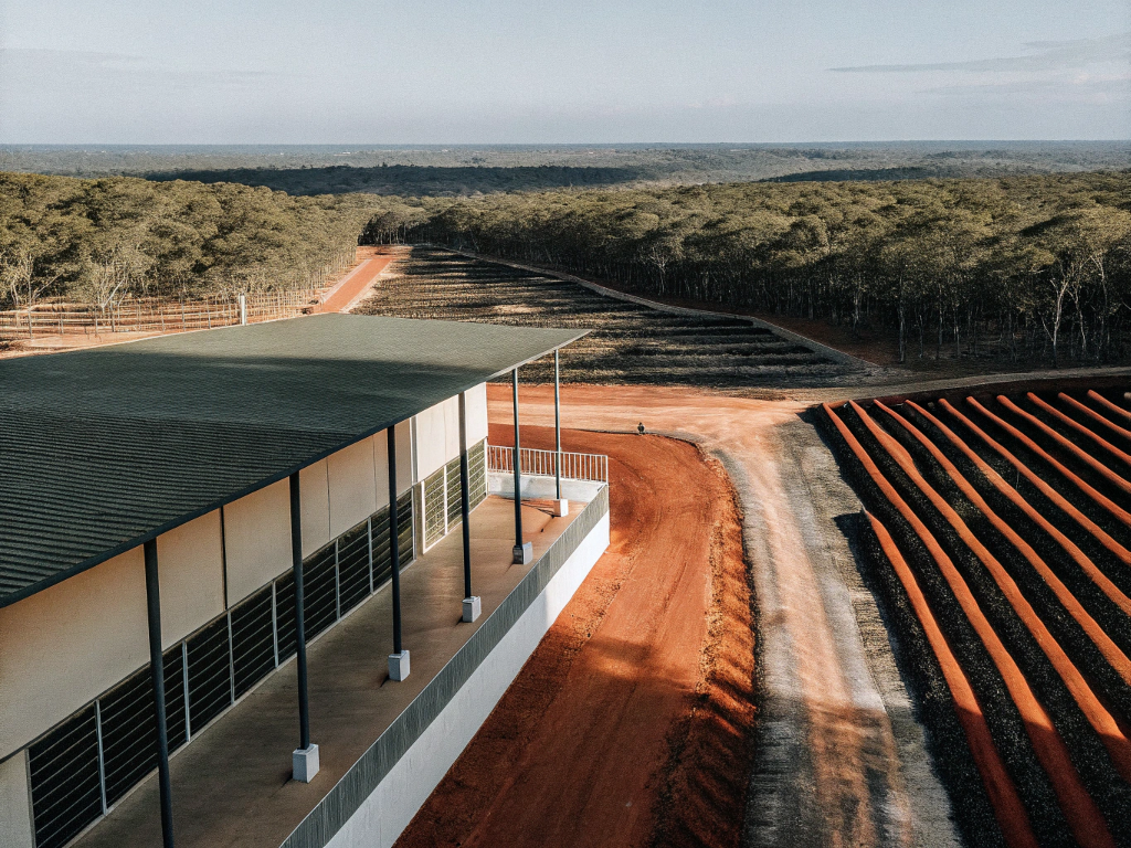Aerial view of a modern coffee processing facility and drying patios in Jequitinhonha.